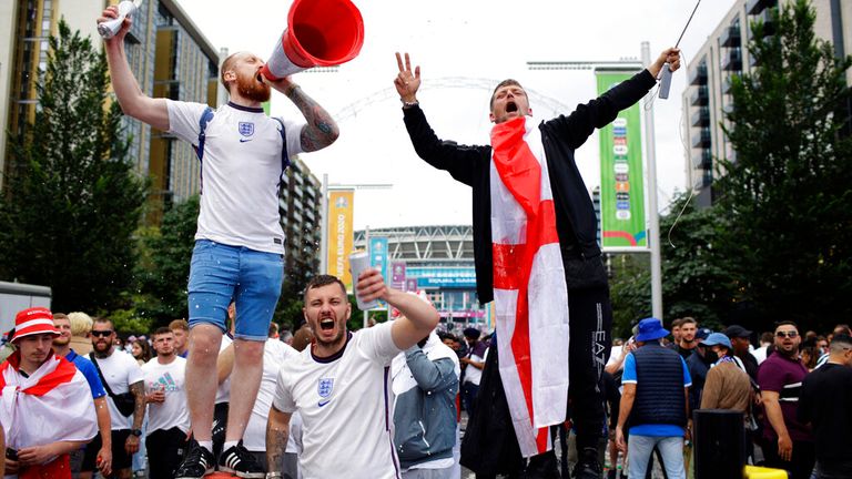 Football fans arrive at Wembley ahead of the final against Italy