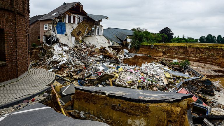 A destroyed road is pictured after flooding in Erftstadt Blessem, Germany