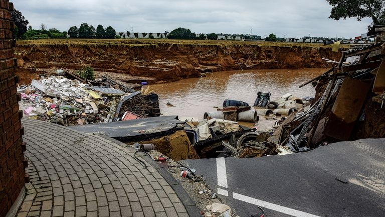 A destroyed road is pictured after flooding in Erftstadt Blessem, Germany
