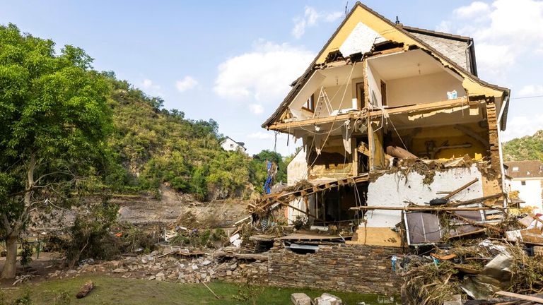 A partially collapsed house stands near the banks of the Ahr river in Altenahr