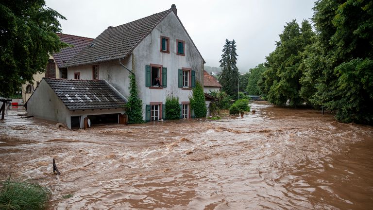 Houses are submerged on the overflowed river banks in Erdorf, Germany. Pic: Harald Tittel/dpa/AP