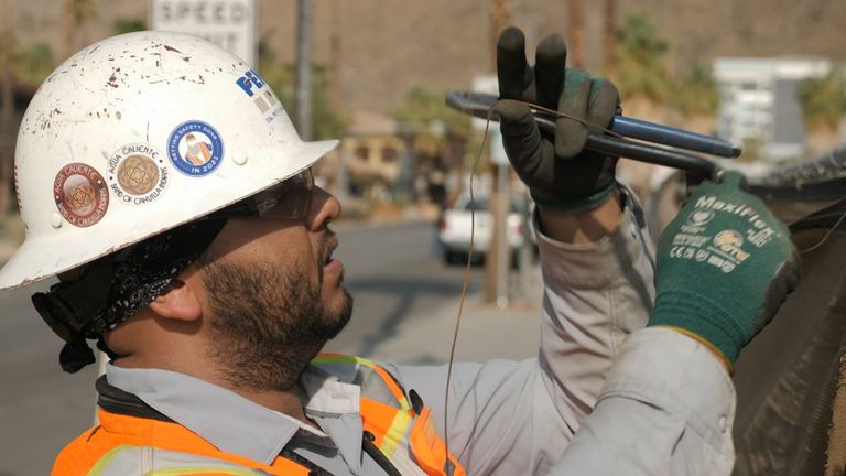 Construction worker Carlos Moreno has shifted his hours to starting earlier in the day and even altered his diet to cope with the heat in Palm Springs, California