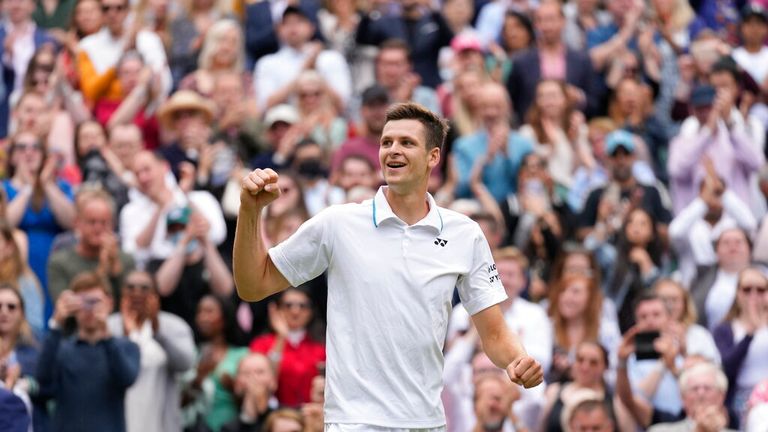 Poland&#39;s Hubert Hurkacz celebrates after defeating Switzerland&#39;s Roger Federer during the men&#39;s singles quarterfinals 