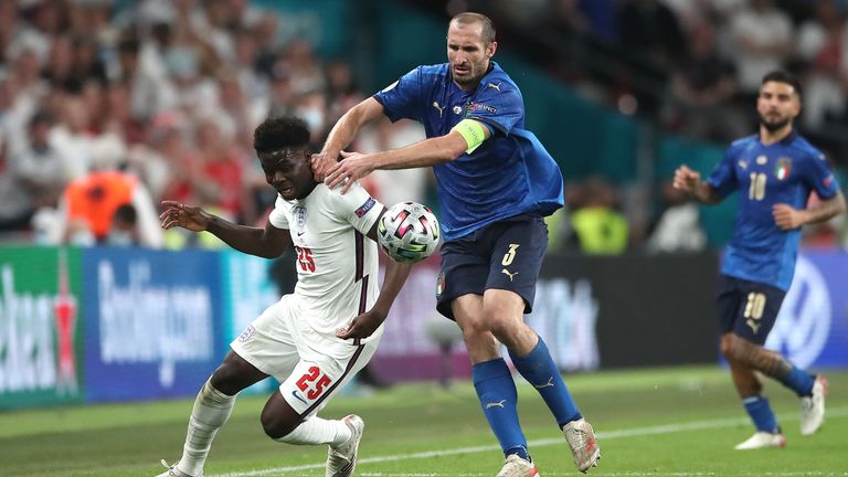 Italy&#39;s Giorgio Chiellini got a yellow card for hauling Bukayo Saka back just before full-time