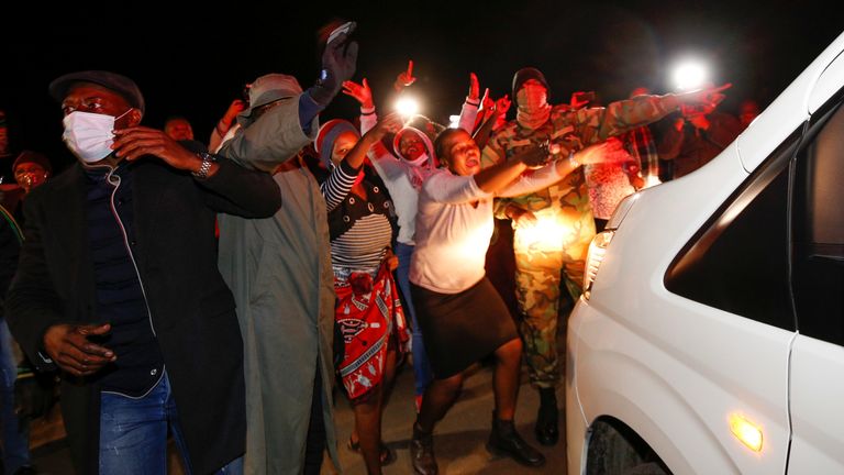 Supporters of former South African President Jacob Zuma rally outside his home in Nkandla, South Africa, July 7, 2021