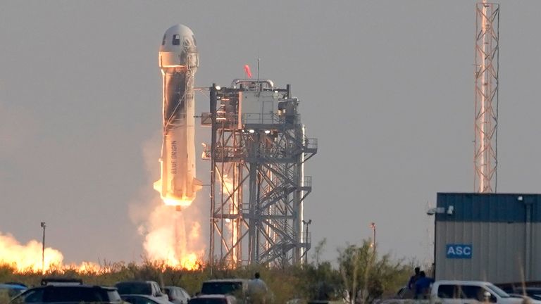 Blue Origin&#39;s New Shepard rocket launches carrying passengers Jeff Bezos, founder of Amazon and space tourism company Blue Origin, brother Mark Bezos, Oliver Daemen and Wally Funk, from its spaceport near Van Horn, Texas, Tuesday, July 20, 2021. (AP Photo/Tony Gutierrez)