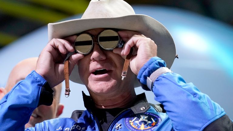 Jeff Bezos wears eyeglasses belonging to pilot Amelia Mary Earhart during a post-launch news briefing.  Pic: AP