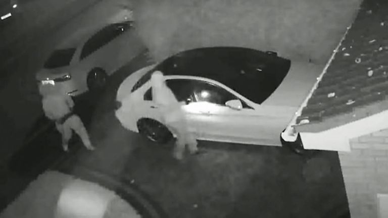 Thieves preparing to steal a car from in front of a house using relay technology. Pic: WMP