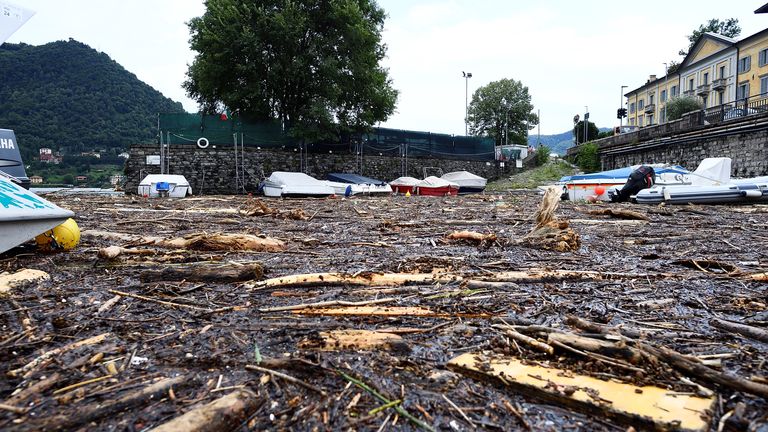 Tree trunks and debris are scattered around Cernobbio, Lake Como