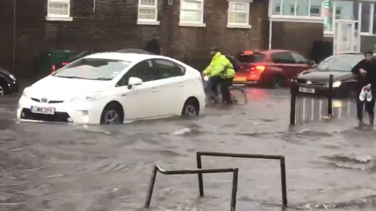 A flooded road in Turnpike Lane, north London. Pic: @braggendasz showing a 