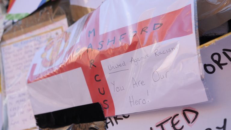 One card reads: &#39;United against racism, you are our hero!&#39;