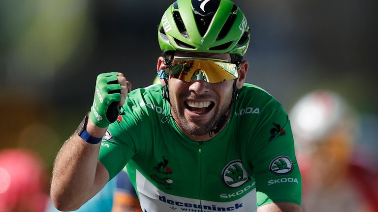 Cycling - Tour de France - Stage 13 - Nimes to Carcassonne - France - July 9, 2021 Deceuninck–Quick-Step rider Mark Cavendish of Britain wearing the green jersey celebrates as he crosses the line to win stage 13 REUTERS/Benoit Tessier
