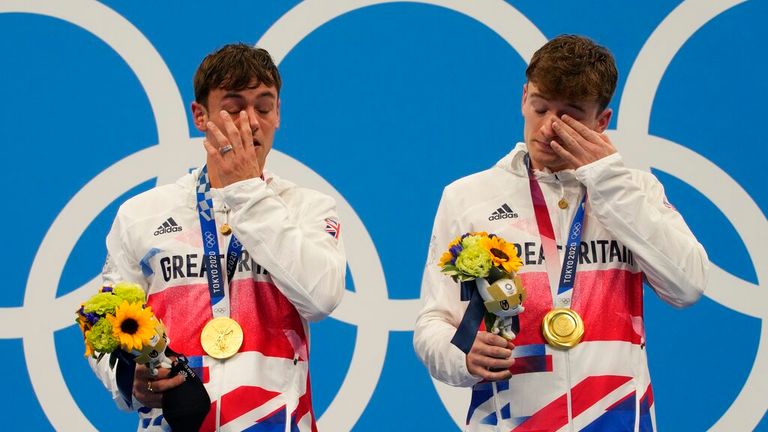 Thomas Daley and Matty Lee of Britain react after winning gold medals during the men&#39;s synchronized 10m platform diving final at the Tokyo Aquatics Centre at the 2020 Summer Olympics, Monday, July 26, 2021, in Tokyo, Japan. (AP Photo/Dmitri Lovetsky)