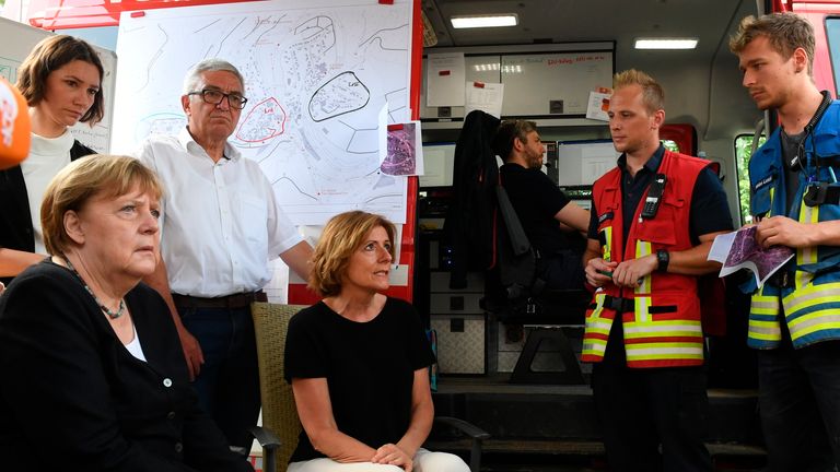 Mrs Merkel met volunteers in the village of Schuld. Pic: AP