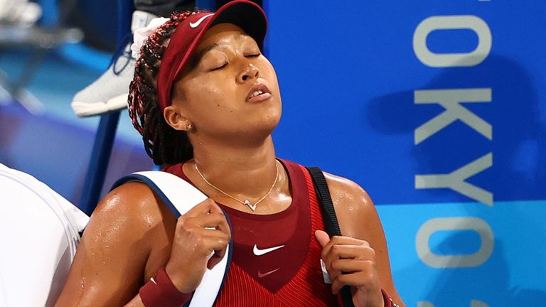 Naomi Osaka of Japan walks off after losing her third round match against Marketa Vondrousova of Czech Republic