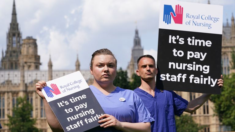 Nurses with placards outside the Royal College of Nursing (RCN) in Victoria Tower Gardens, London. The Government has come under attack for failing to announce an expected pay rise for NHS staff in England. Picture date: Wednesday July 21, 2021.