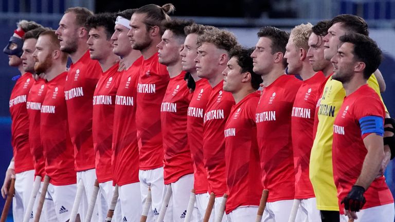 Great Britain line up during the national anthem before a men&#39;s field hockey match against South Africa at the 2020 Summer Olympics, Saturday, July 24, 2021, in Tokyo, Japan. (AP Photo/John Locher)