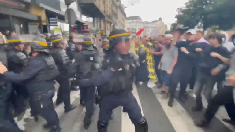 Thousands of protesters took to the streets in Paris, with some clashing with police officers.