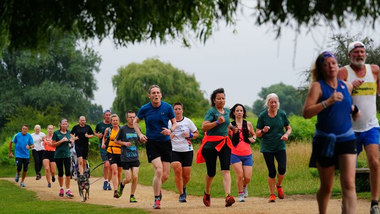 Runners taking part in the Parkrun at Bushy Park in London, the largest and oldest Parkrun in the UK, and one of many runs taking place across the country for the first time since last March. Picture date: Saturday July 24, 2021.