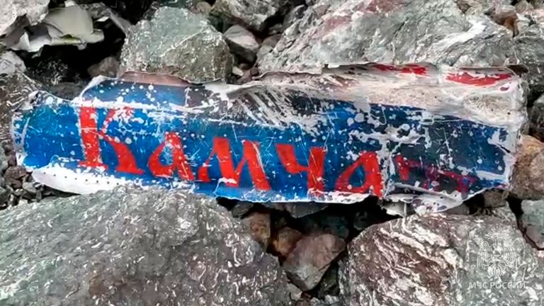 This photo taken from video released by the Russia Emergency Situations Ministry press service on Wednesday, July 7, 2021, shows a part of the wreckage of a missing Antonov An-26 missing plane found near its destination airport outside the town of Palana, in Russia&#39;s Far East. Authorities in Russia say rescuers have found the bodies of nine victims a day after a plane crash in a remote area in the country&#39;s Far East. The world reads Kamchatka. (Russia Emergency Situations Ministry press service 