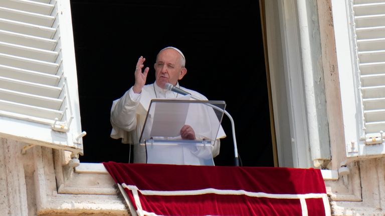 Pope Francis recites the Angelus noon prayer from the window of his studio overlooking St.Peter&#39;s Square, at the Vatican. In a brief announcement Sunday afternoon the Vatican said Pope Francis has gone to a Rome hospital for scheduled surgery for a stenosis, or restriction, of the large intestine. (AP Photo/Alessandra Tarantino)