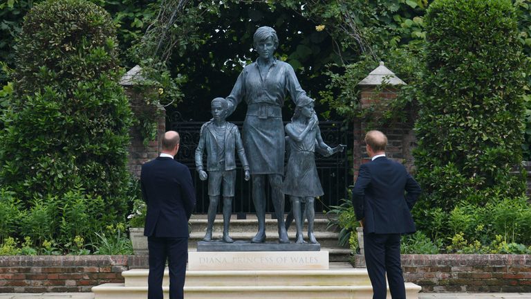 Britain's Prince William and Prince Harry look at the staue they commissioned of their mother Princess Diana, on what woud have been her 60th birthday, in the Sunken Garden at Kensington Palace, London, Thursday July 1, 2021. (Dominic Lipinski /Pool Photo via AP)