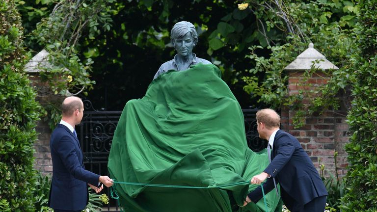 Britain&#39;s Prince William, left and Prince Harry unveil a statue they commissioned of their mother Princess Diana, on what woud have been her 60th birthday, in the Sunken Garden at Kensington Palace, London, Thursday July 1, 2021. (Dominic Lipinski /Pool Photo via AP)