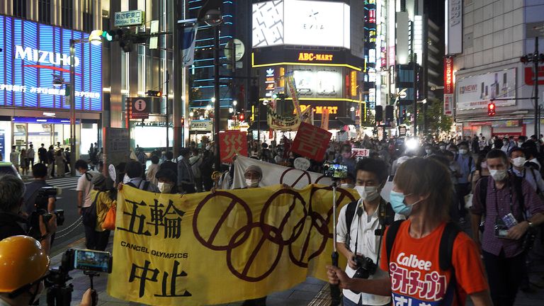 People who are against the Tokyo 2020 Olympics set to open in July, march to protest in Shinjuku district during an anti-Olympics demonstration Wednesday, June 23, 2021, in Tokyo. (AP Photo/Kantaro Komiya)