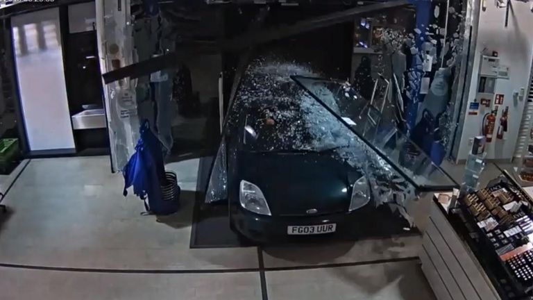 Wiltshire Police released dramatic footage showing the moment a car was driven into a pharmacy as part of a £15k raid.