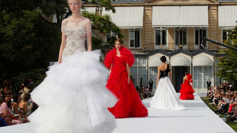 Models present creations by designers Tamara Ralph and Michael Russo as part of their Haute Couture Fall/Winter 2019/20 collection show for fashion house Ralph & Russo in Paris, France, July 1, 2019