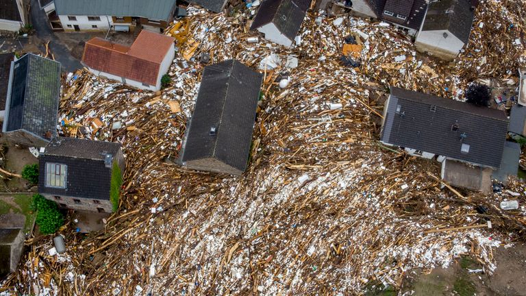 Trees and other detritus were left between houses in Schuld. Pic: Associated Press