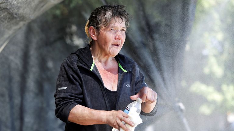 A woman cools off during the heatwave in Seattle, Washington