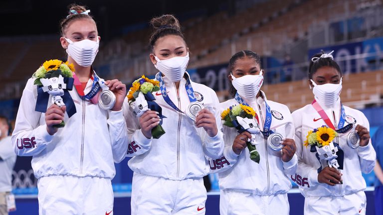 Biles (R) and her US teammates won silver medals in the team event