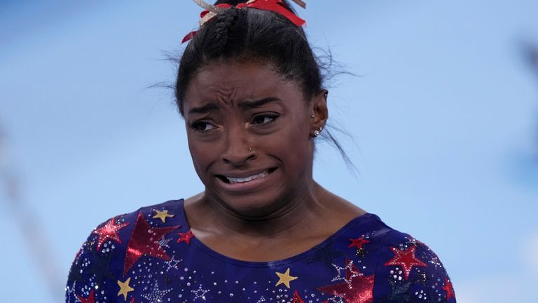 Biles reacts after performing on the uneven bars. Pic: AP