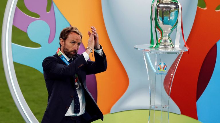 Soccer Football - Euro 2020 - Final - Italy v England - Wembley Stadium, London, Britain - July 11, 2021 England manager Gareth Southgate applauds fans after the match next to the trophy Pool via REUTERS/John Sibley TPX IMAGES OF THE DAY
