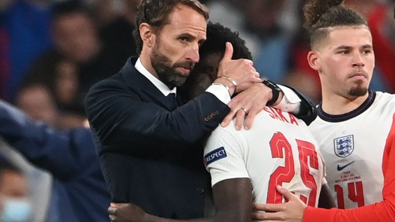 Soccer Football - Euro 2020 - Final - Italy v England - Wembley Stadium, London, Britain - July 11, 2021 England manager Gareth Southgate and Bukayo Saka look dejected after loosing the Euro 2020 final Pool via REUTERS/Andy Rain