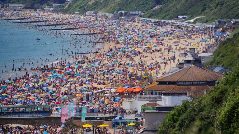 People enjoy the weather on Bournemouth beach in Dorset. England could see the hottest day of the year this weekend as the skies finally clear after weeks of wet and humid weather. Picture date: Saturday July 17, 2021.

