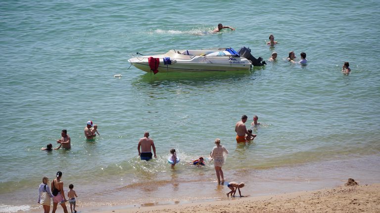 People enjoy the weather on Bournemouth beach in Dorset. England could see the hottest day of the year this weekend as the skies finally clear after weeks of wet and humid weather. Picture date: Saturday July 17, 2021.

