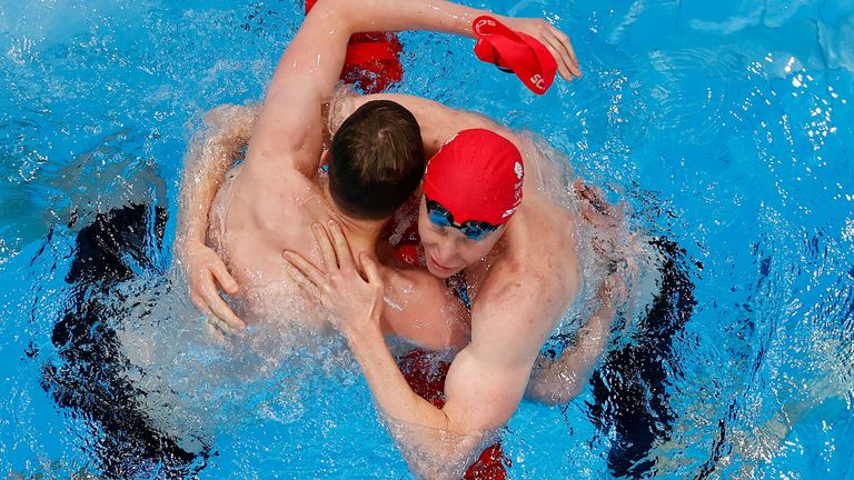 Tom Dean of Britain and Duncan Scott of Britain celebrate after winning gold and silver