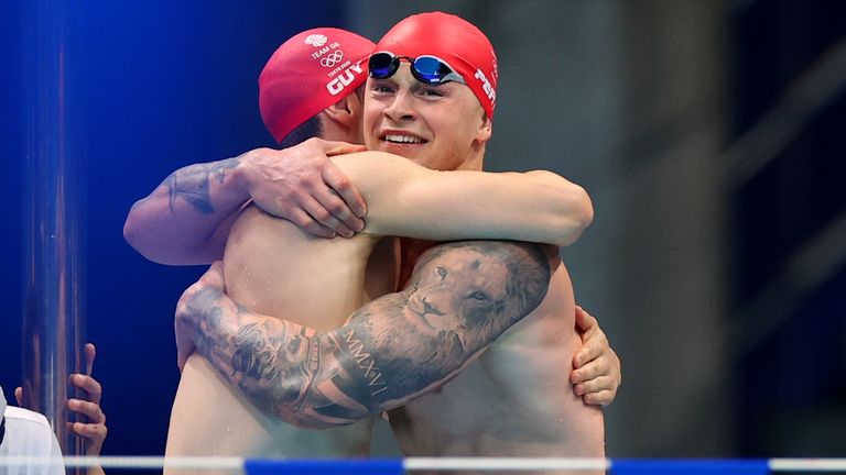 Guy and Peaty celebrate after being part of the team that cemented a new world record in the 4x100m medley relay