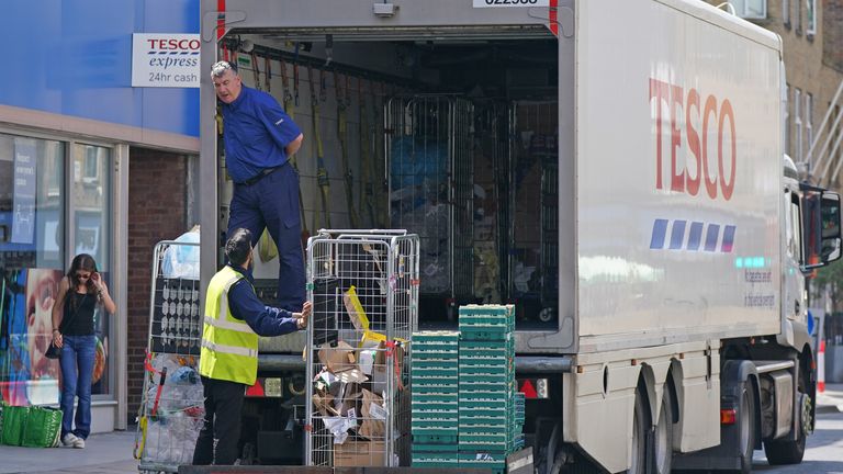 A delivery lorry outside a Tesco Express store in central London. Pressure is mounting on the Government to bring forward the date at which people who are double vaccinated against coronavirus can avoid self-isolation as emergency measures to protect food supplies were launched on Thursday. Picture date: Friday July 23, 2021.