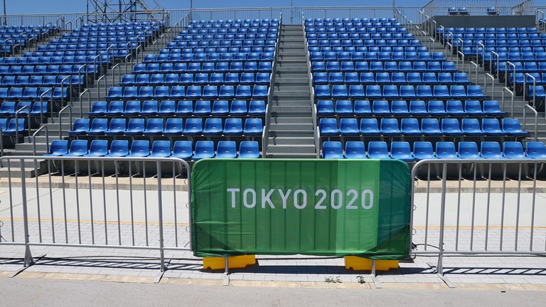 Tokyo 2020 Olympics - Rowing Training Sessions - Sea Forest Waterway, Tokyo, Japan - July 18, 2021 General view of seats and Tokyo 2020 Olympics signage REUTERS/Thomas Peter
