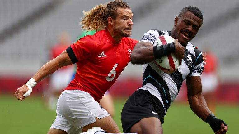 Jiuta Wainiqolo of Fiji battles with Britain&#39;s captain Tom Mitchell in a disappointing match for Team GB
