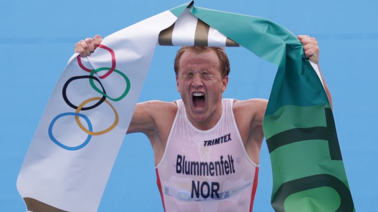 Norway&#39;s Kristian Blummenfelt celebrates his gold at the finish line