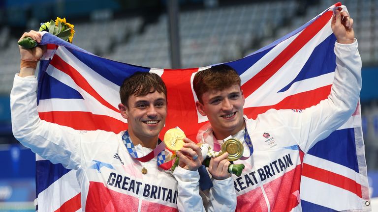 Tokyo 2020 Olympics - Diving - Men&#39;s 10m Platform Synchro - Medal Ceremony - Tokyo Aquatics Centre, Tokyo, Japan July 26, 2021. Thomas Daley of Britain and Matty Lee of Britain pose with the gold medal REUTERS/Kai Pfaffenbach