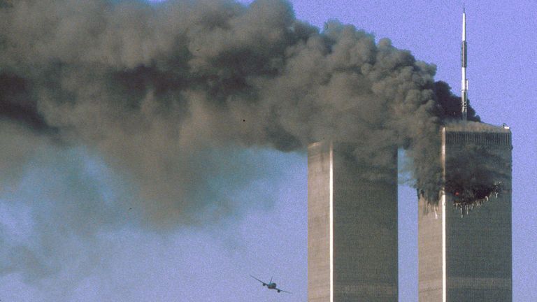 Hijacked United Airlines Flight 175 (L) flies toward the World Trade Center twin towers shortly before slamming into the south tower (L) as the north tower burns following an earlier attack by a hijacked airliner in New York City September 11, 2001. The stunning aerial assaults on the huge commercial complex where more than 40,000 people worked on an ordinary day were part of a coordinated attack aimed at the nation&#39;s financial heart. They destroyed one of America&#39;s most dramatic symbols of powe