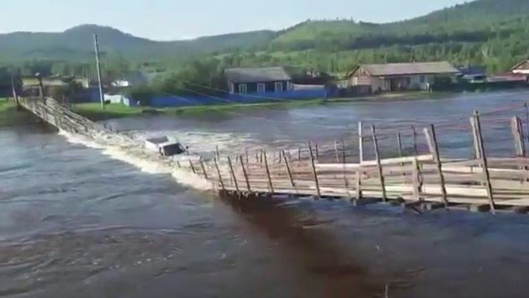 A suspension bridge collapsed as a truck tried to drive across during severe floods in eastern Russia
