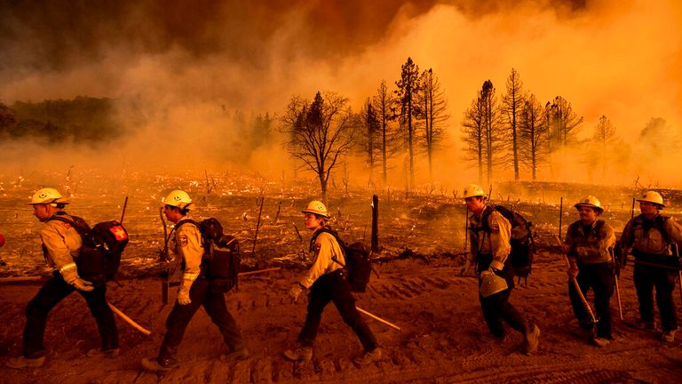 Firefighters from the California Department of Forestry and Fire Protection&#39;s Placerville station battle raging blazes