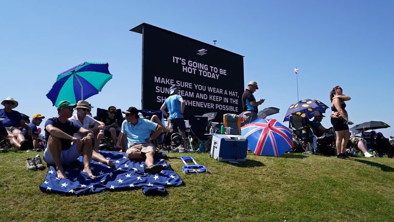 A video screen shows a hot weather warning as fans wait for the start of the British Formula One Grand Prix, at the Silverstone circuit, in Silverstone. Pic: AP