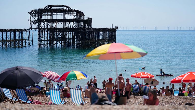 People enjoy the hot weather on Brighton beach